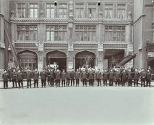 Firemen lined up outside Bishopsgate Fire Station, Bishopsgate, City of London, 1908. Artist: Unknown.
