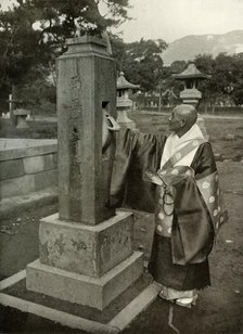 'A Buddhist Priest and Praying-Wheel', 1910. Creator: Herbert Ponting.