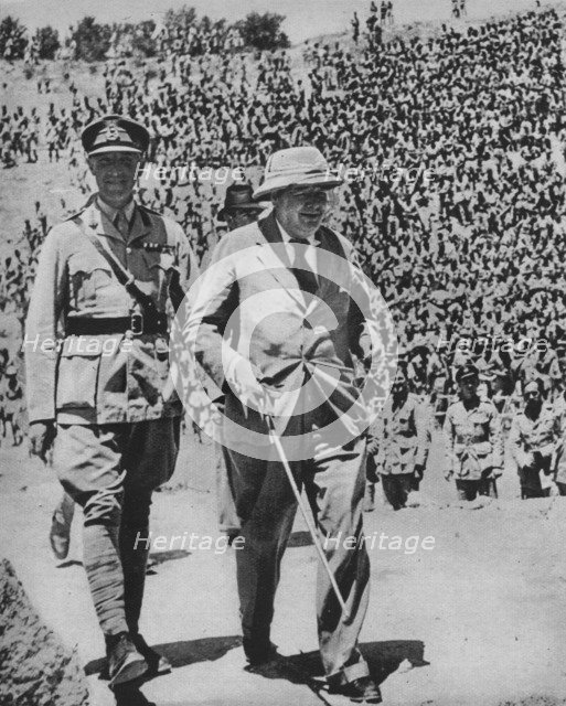 'Home via the Battlefields - Mr Churchill in the ancient Roman amphitheatre at Carthage', 1943-44. Artist: Unknown.