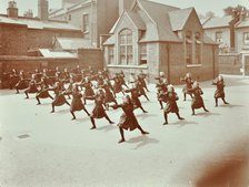 Girls doing drill in the playground, Wilton Road School, London, 1907. Artist: Unknown.
