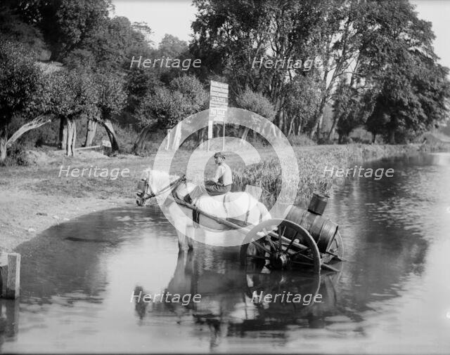 A boy with a horse drawn water cart, filling up in the River Thames, Shiplake, Oxfordshire,1860-1922 Creator: Henry Taunt.