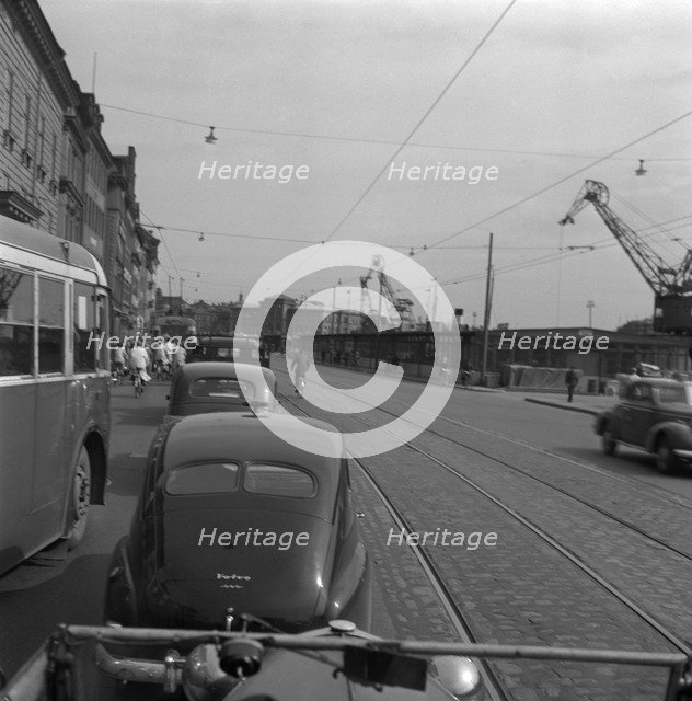 Heavy traffic outside the Royal Palace, Stockholm, Sweden, 1950. Artist: Torkel Lindeberg