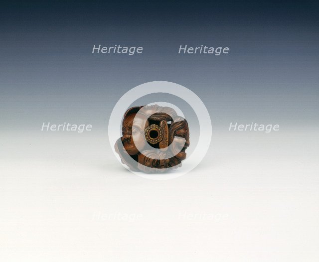 Wooden netsuke of seven Noh masks, late Edo period, Japan, 19th century. Artist: Koyosai