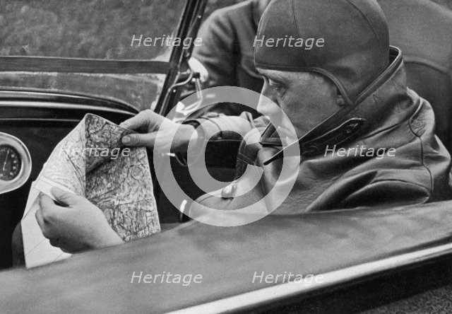 Adolf Hitler specifies the travel route, Germany, 1936. Artist: Unknown