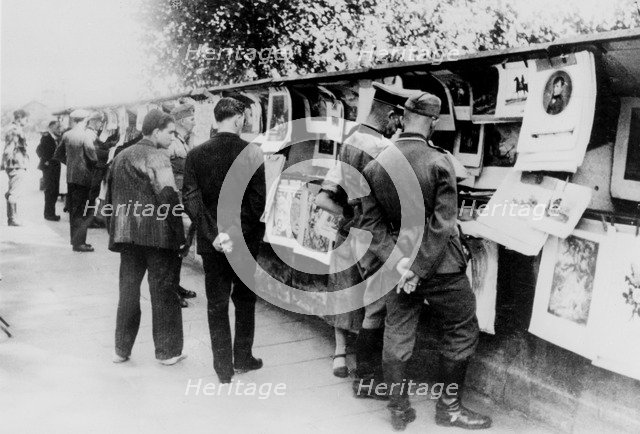 Second-hand book and print stalls on the bank of the Seine, German-occupied Paris, 1940. Artist: Unknown