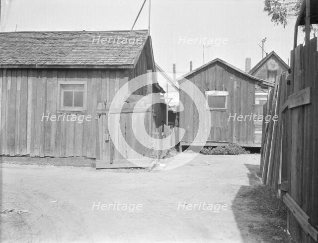 Mexican quarter of Los Angeles, one quarter mile from City Hall, California, 1936. Creator: Dorothea Lange.