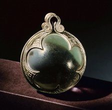 Silver-mounted rock-crystal sphere, a pendant from a necklace.