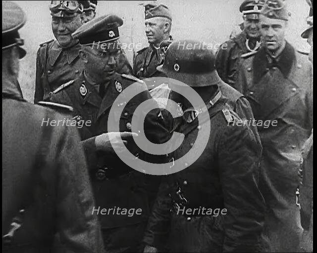 Heinrich Himmler Standing Next to and Pointing Towards a German Army Commander With..., 1939. Creator: British Pathe Ltd.