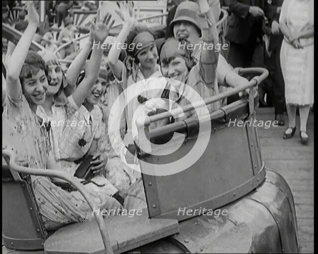A Large Group of Female Civilians Enjoying  a Roller Coaster Ride, 1926. Creator: British Pathe Ltd.
