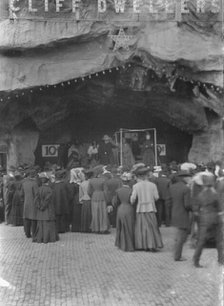 Sidewalk performance or carnival performance, Cliff Dwellers, between 1896 and 1911. Creator: Arnold Genthe.