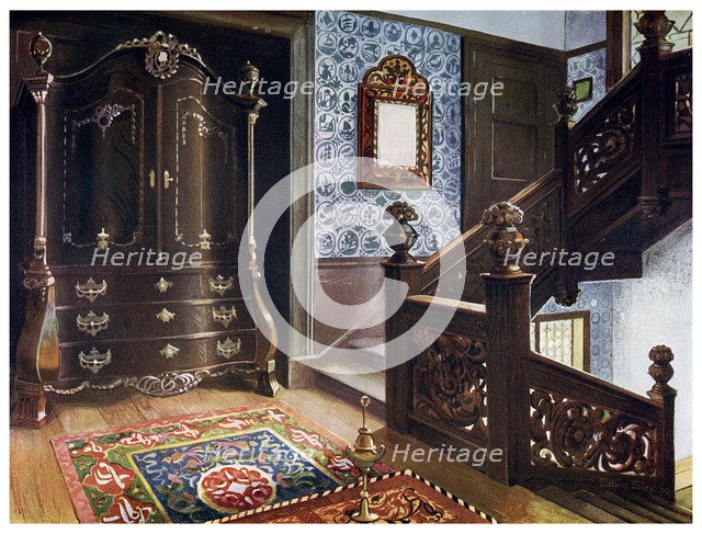 Carved walnut bombe armoire with chased mounts, 1910.Artist: Edwin Foley