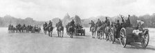 Horse-drawn artillery passing the Palace of Versailles, France, August 1914. Artist: Unknown