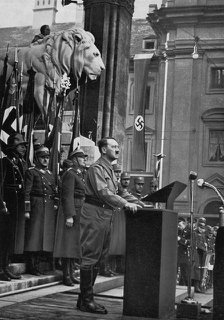 Adolf Hitler speaking at the Feldherrnhalle, Munich, Germany, 9 November 1934. Artist: Unknown
