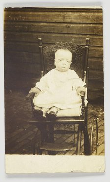 Photographic postcard of a baby in a stroller, 1918-1930. Creator: Unknown.