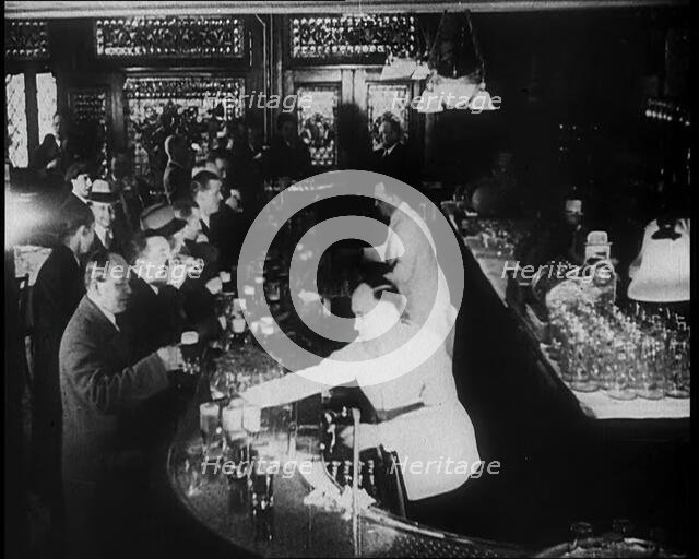 American Civilians Celebrating the End of Prohibition Drinking in a Bar, 1930s. Creator: British Pathe Ltd.