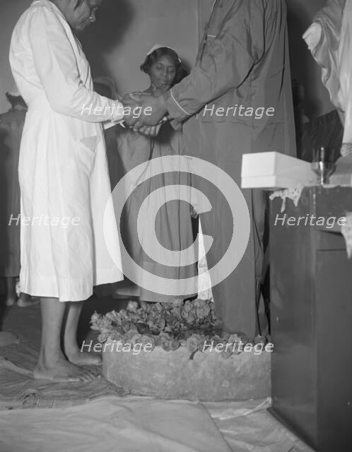 Reverend Vondell Gassaway, pastor of the St. Martin's Spiritual Church..., Washington, D.C., 1942. Creator: Gordon Parks.
