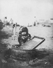 Child at washtub, c1905. Creator: Frank H. Nowell.