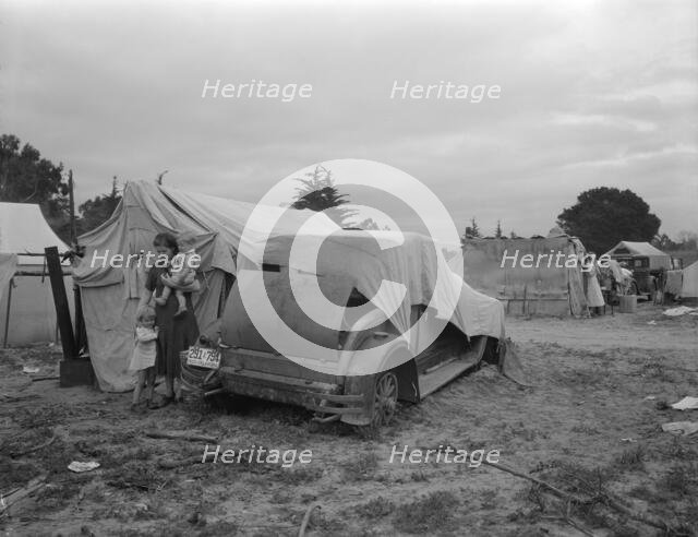 Migrant family looking for work in the pea fields, California, 1936. Creator: Dorothea Lange.