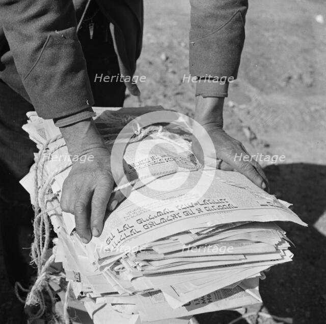 The hands of Mr. Venus Alsobrook, official salvage collector for the..., Washington, D.C., 1942. Creator: Gordon Parks.