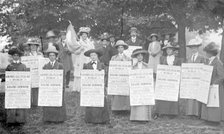A 'poster parade' of suffragettes advertising a meeting to be held on Ealing Common, June 1912. Artist: Unknown