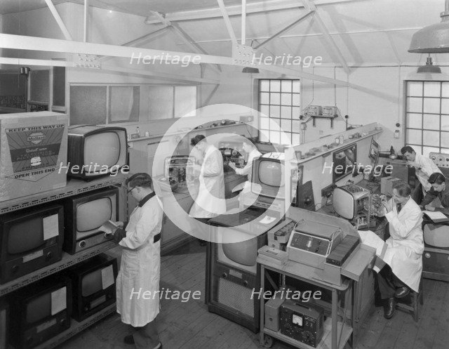 Technicians at work in Clays TV repair in shop, Mexborough, South Yorkshire, February 1959. Artist: Michael Walters