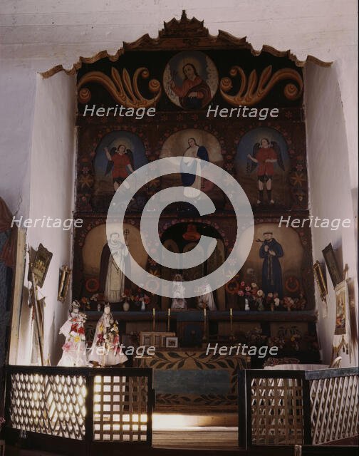 The main altar in the church, Trampas, N.M. , 1943. Creator: John Collier.