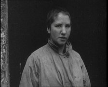 An Irish Woman Sporting a Shaved Head as Punishment for Consorting With British Soldiers, 1920. Creator: British Pathe Ltd.