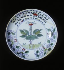 Doucai plate with pomegranate tree and floral groups, Qing dynasty, China, 1700-1722. Artist: Unknown