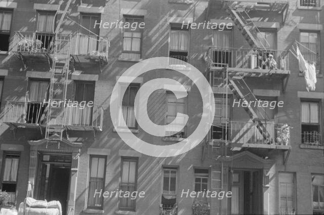 House fronts, 61st Street between 1st and 3rd Avenues, New York, 1938. Creator: Walker Evans.