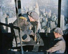 'Rivetting the last bolts on "The Morning Mast" of the Empire State building', c1931. Creator: Lewis Wickes Hine.