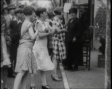 Female Children Throwing Balls at a Coconut Shy, 1926. Creator: British Pathe Ltd.