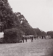 [Encampment alongside a stand of trees]. Brady album, p. 123, 1861-65. Creator: Unknown.