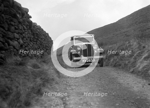 Kitty Brunell road testing a Standard Little Twelve saloon, c1932. Artist: Bill Brunell.