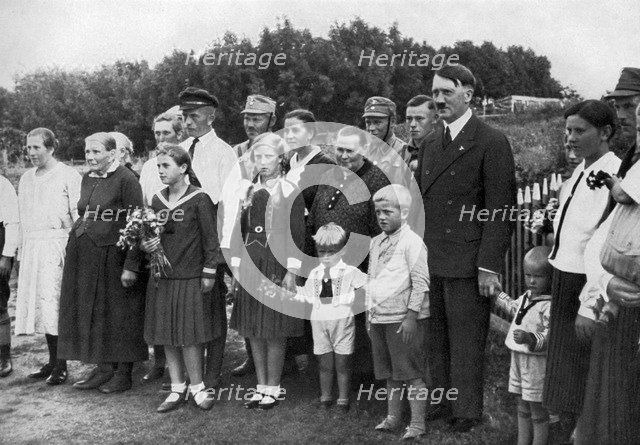 Adolf Hitler visiting a farming family in East Prussia, Germany, 1936. Artist: Unknown