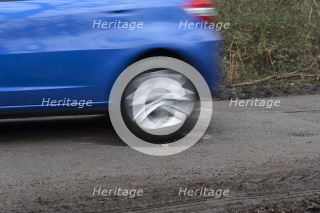 Pot holes in road surface 2017. Creator: Unknown.