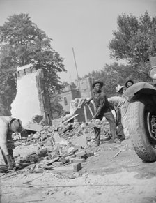 Loading debris from wrecked buildings along Independence Avenue, Washington, D.C, 1942. Creator: Gordon Parks.