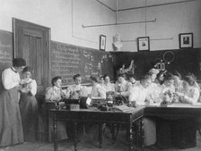 Group of young women studying electro-magnets in normal school, Washington, D.C., (1899?). Creator: Frances Benjamin Johnston.