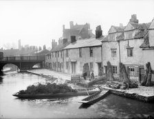 Abel Beesley, Oxford University waterman, and his rush punt, Fisher Row, Oxford, c1860-c1922. Artist: Henry Taunt