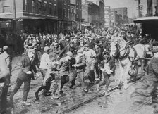 Rioters charging horse-drawn car, later wrecking it on Kensington Ave., Philadelphia, 1910. Creator: Bain News Service.