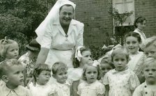 Matron Joan Gardner and children at St Monan's Hospital, 1952. Creator: Unknown.