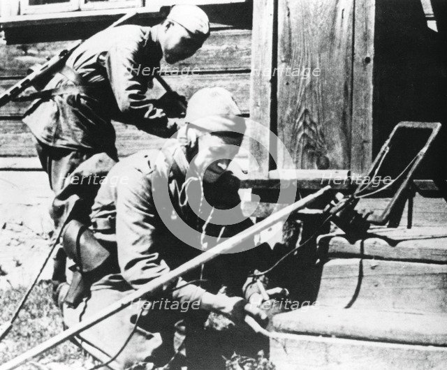 Russian soldiers with mine detectors clearing a booby-trapped house, Eastern Front, 1944. Artist: Unknown