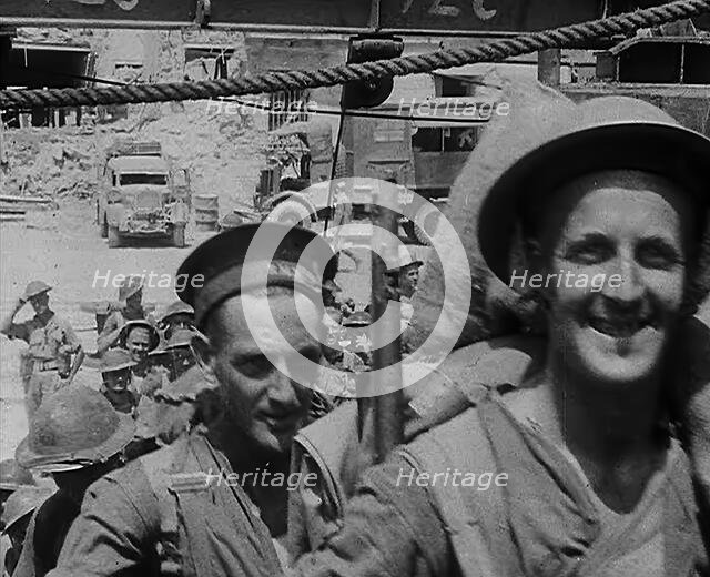 British Troops Marching Through a Dock in North Africa, 1943. Creator: British Pathe Ltd.