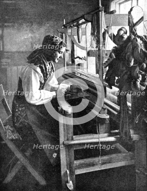 Woman using a loom, Sweden, 1936. Artist: Unknown