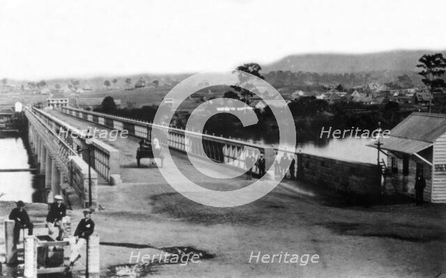 Crossing the first permanent Victoria Bridge, Brisbane, c1874. Creator: Unknown.