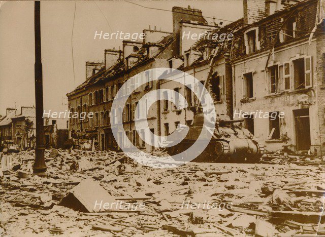 An American tank stands in a road in Cherbourg, Normandy, 1944. Artist: Unknown