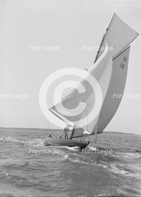 The 8 Metre yacht 'Antwerpia' (H19) sailing with spinnaker, 1911. Creator: Kirk & Sons of Cowes.