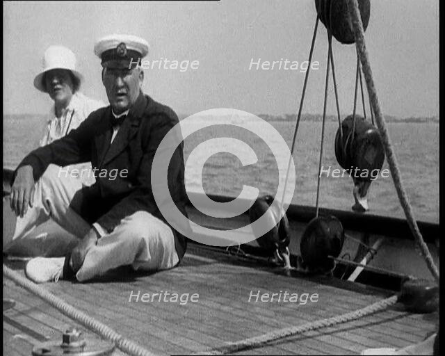 A Man and a Woman Sitting on the Deck of a Yacht at  Cowes, 1933. Creator: British Pathe Ltd.