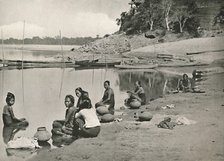 'Typical Riverside Scene on the great Irrawaddy - Women bathing and drawing water', 1900. Creator: Unknown.
