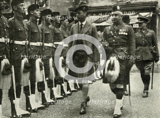 'His Majesty Inspecting The Guard Of Honour Of The Black Watch At Perth in August, 1935.  Creator: Unknown.