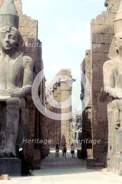 Massive Ancient Egyptian statues and columns at Luxor, Egypt. Artist: Unknown